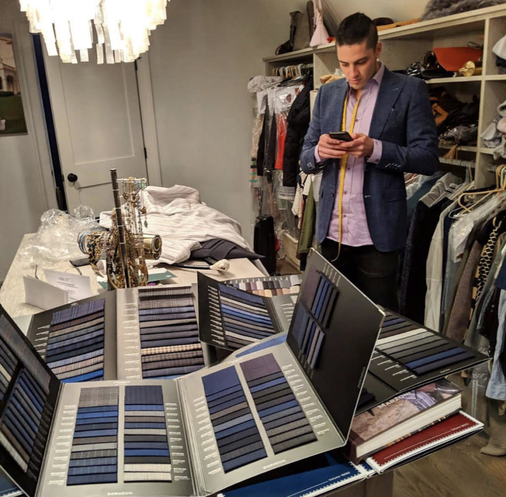 Bijan in a closet organizing materials