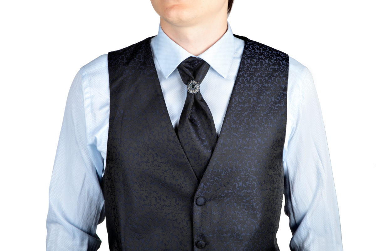 Man in dark blue suit vest