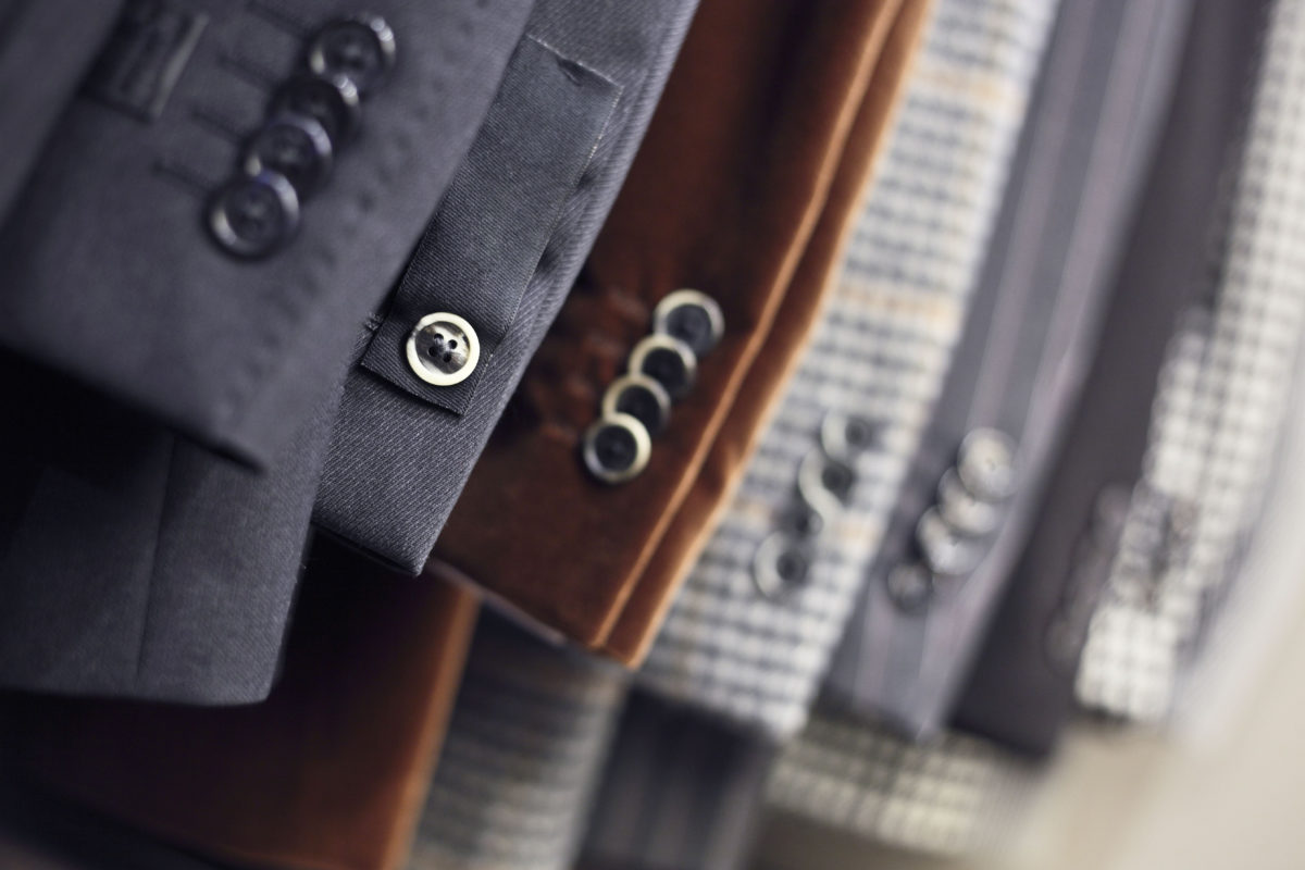Detail of men's jackets' line in a shop, DOF