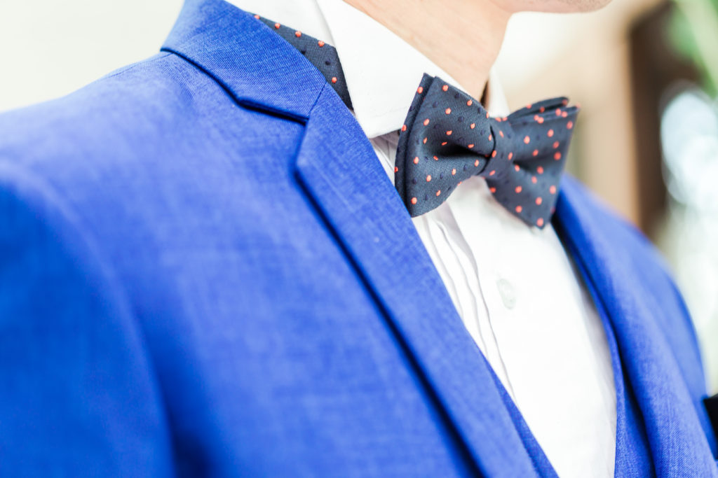 Close-up of a groom in blue wedding dress