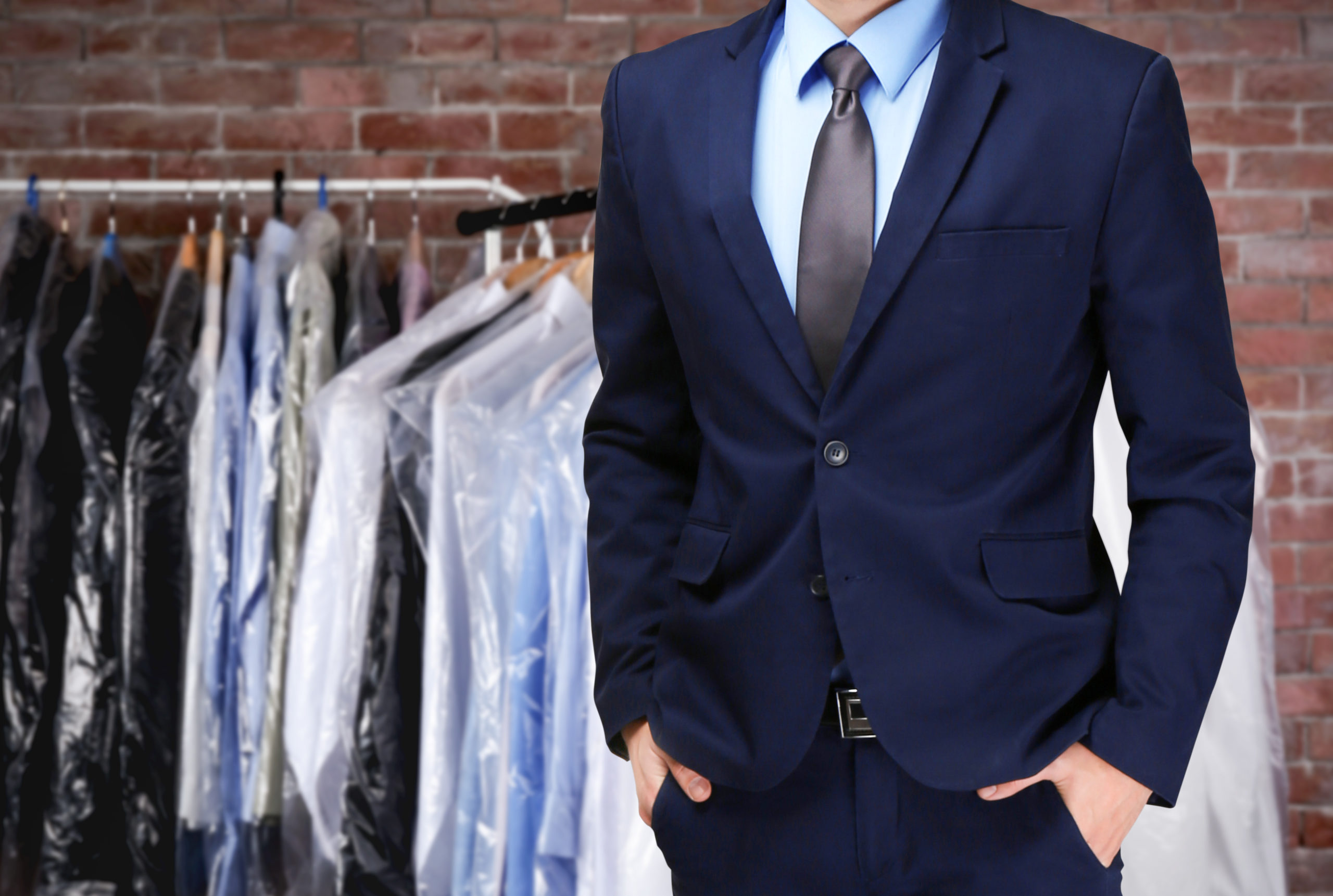 Dry cleaning concept. Businessman on blurred background